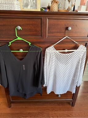 2 Lightweight Black & Black w/ White Polka Dot V-Neck Blouses w/ Bows in Back.